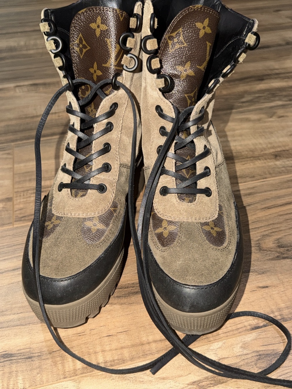 Louis Vuitton women’s Laureate Monogram Suede Combat Boots